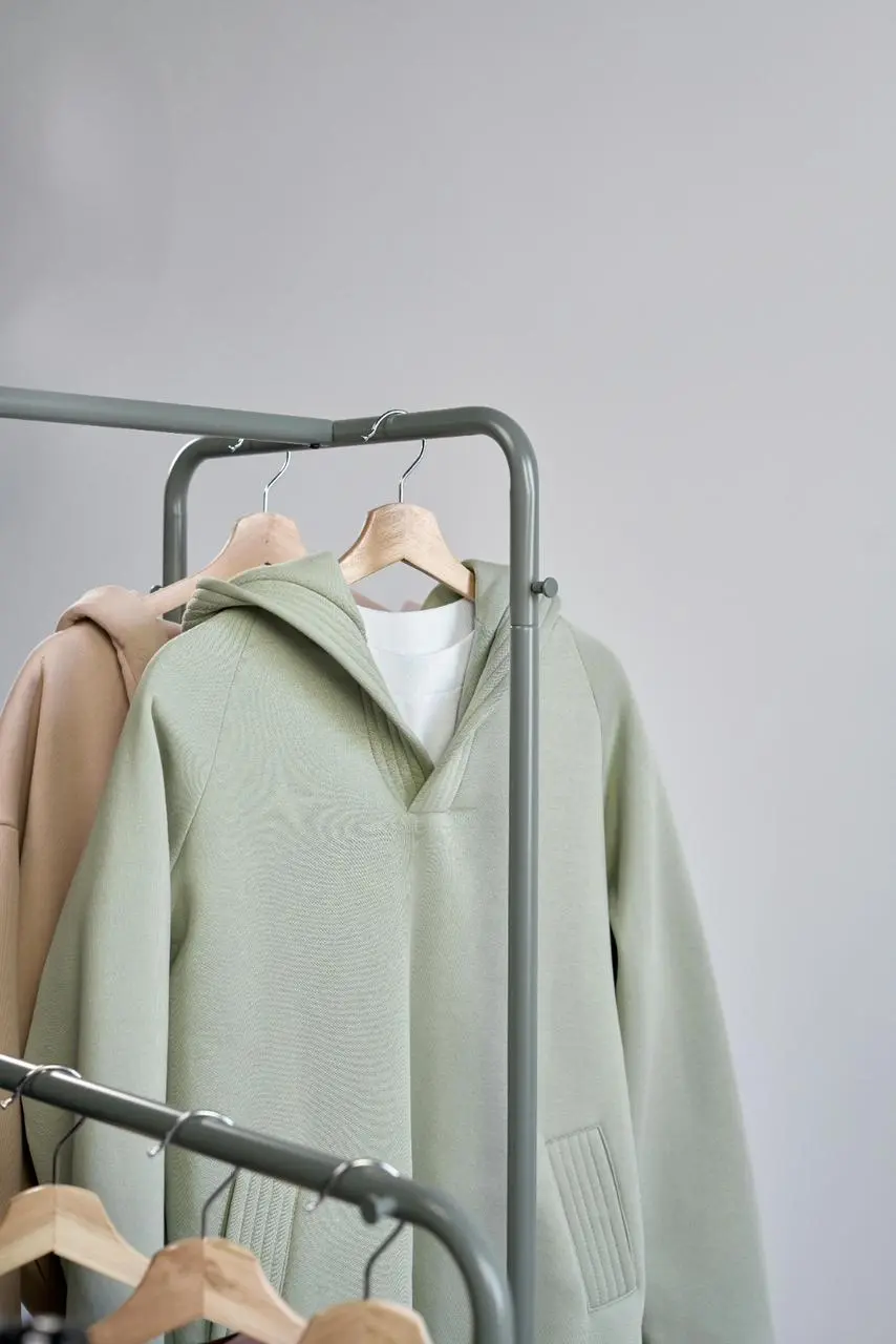 A clothing rack displaying various garments hanging neatly on hangers.